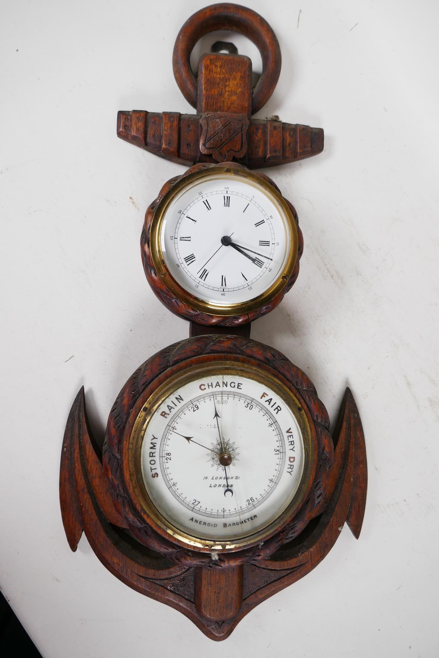 A nautical themed aneroid barometer and clock mounted in a carved oak rope and anchor frame, 21"