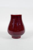 A Chinese sang de boeuf glazed porcelain squat vase, 4½" high