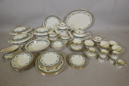 A full Minton 'Grasmere' blue six place dinner service with gilt rims, with matching tea and
