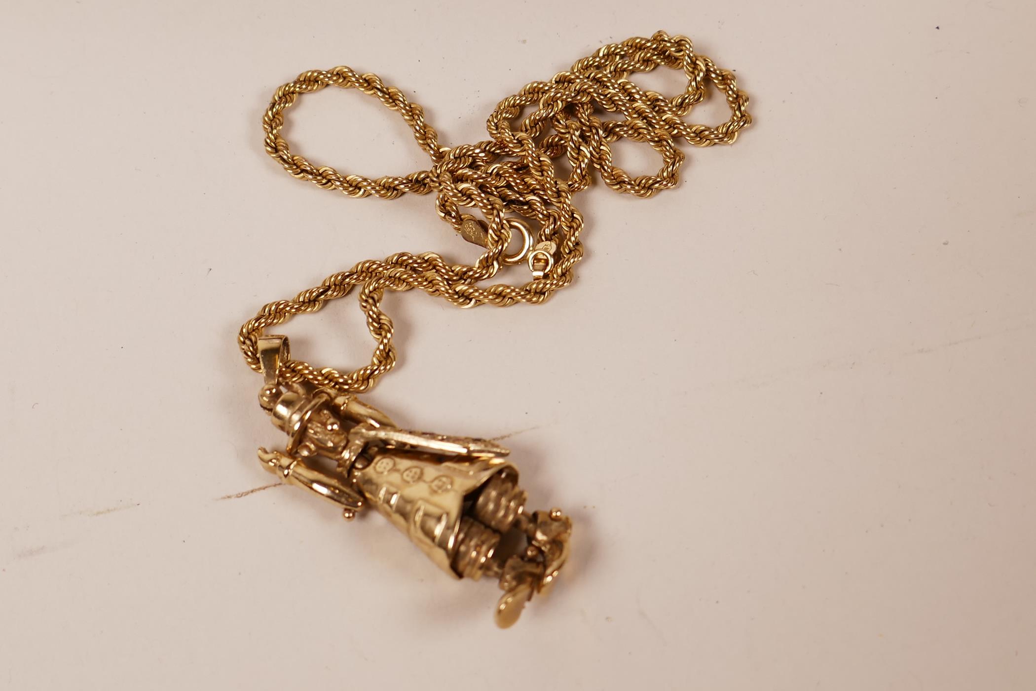 A 9ct gold pendant in the form of a clown, with articulated limbs and tie set with rubies and - Image 2 of 3