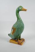 A Chinese Tang style sancai glazed pottery duck, 12½" high