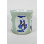 A Chinese celadon glazed porcelain brush pot with blue, white and red decorative panels depicting