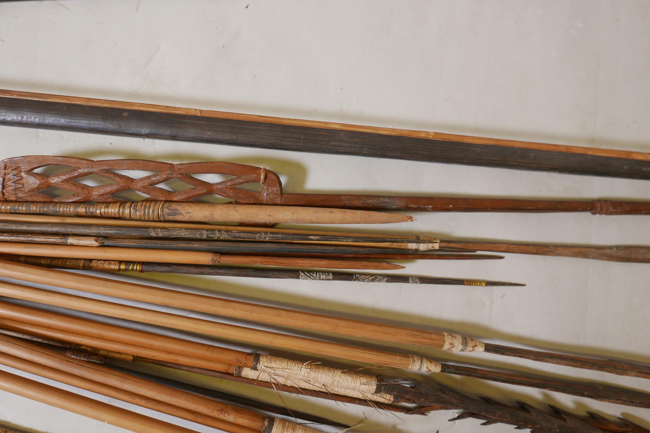 A collection of tribal longbows and spears, most with bamboo shafts and all with wood tips, - Image 3 of 4