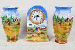 An 1930s English pottery clock set of dome top clock and two side vases printed with pastoral