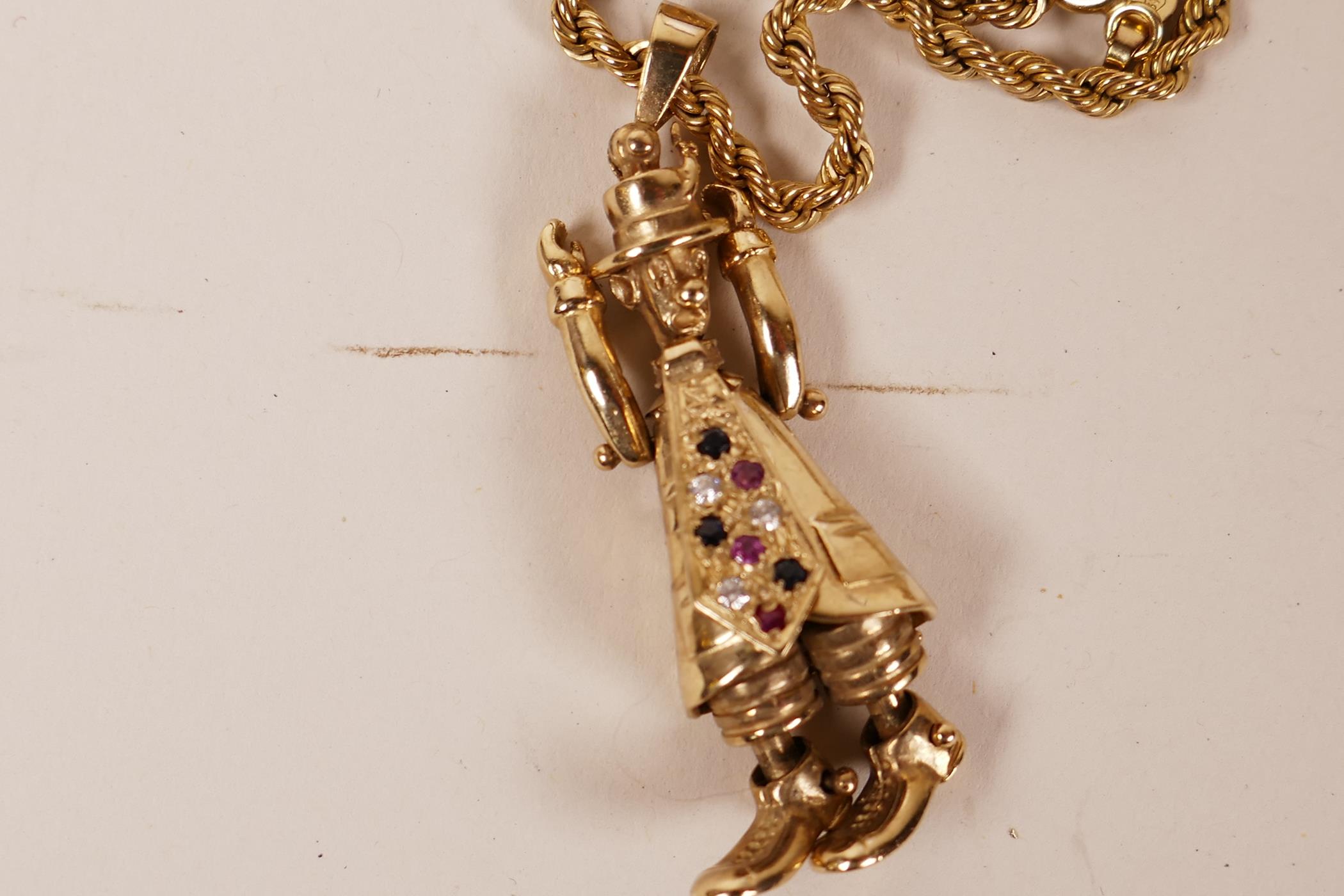 A 9ct gold pendant in the form of a clown, with articulated limbs and tie set with rubies and - Image 3 of 3