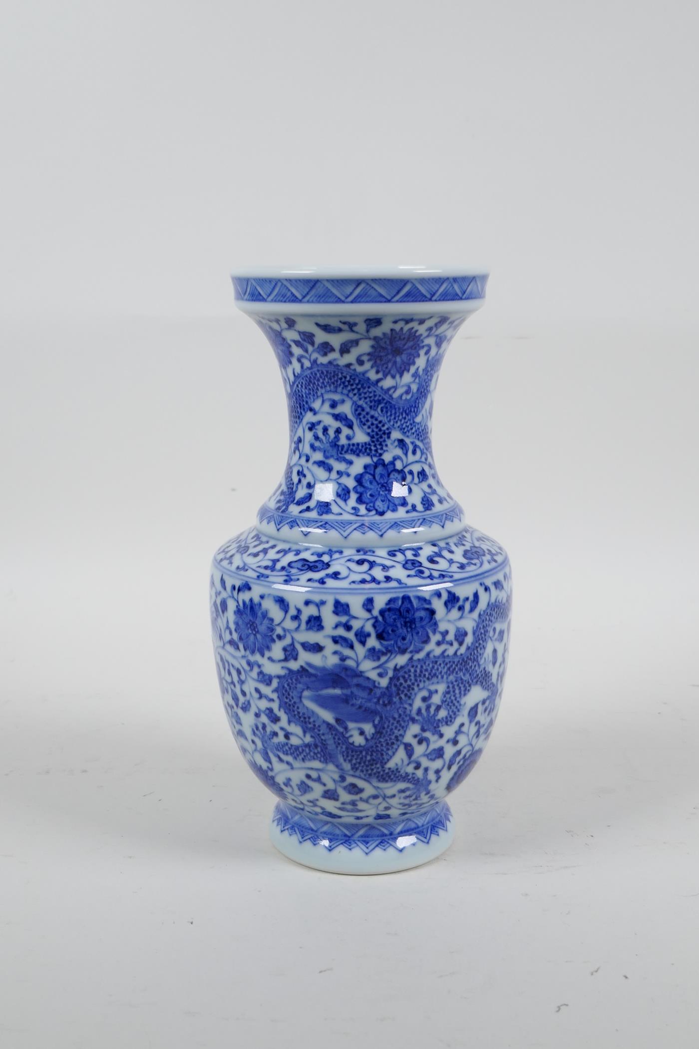 A Chinese blue and white porcelain vase with dragon and lotus flower decoration, seal mark to - Image 3 of 5
