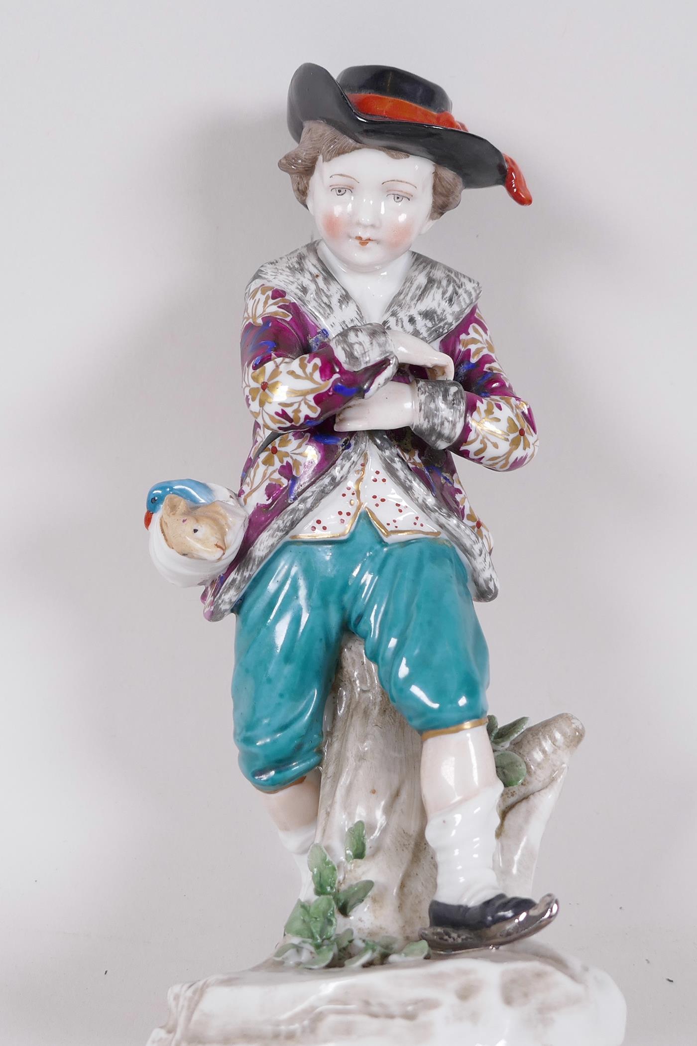 A Continental porcelain figure of a boy skater with a swag of game on his belt, anchor mark to base, - Image 3 of 5