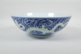 A Chinese blue and white porcelain bowl with twin dragon decoration, 6 character mark to base, 10"