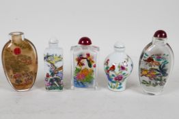 Five Chinese snuff bottles: two polychrome enamelled porcelain depicting Asiatic birds and