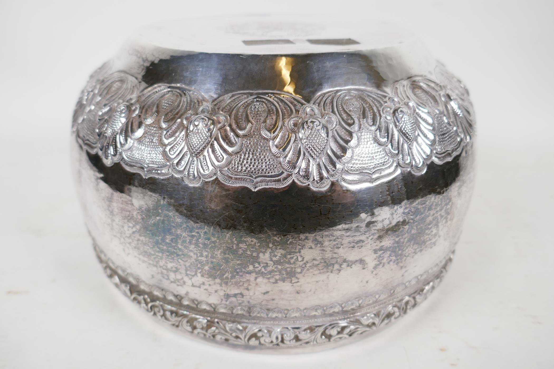 An antique Indian silver bowl, hammered silver with embossed scrolling decoration, a bas relief - Image 5 of 8