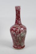A Chinese mottled red and green porcelain yen yen vase with a slender neck, 9" high