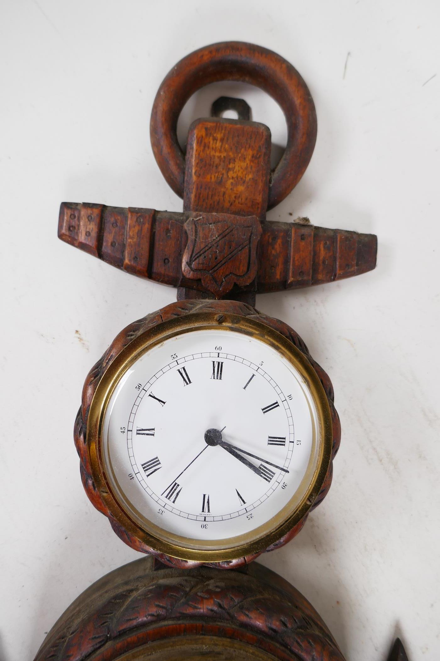 A nautical themed aneroid barometer and clock mounted in a carved oak rope and anchor frame, 21" - Image 2 of 3