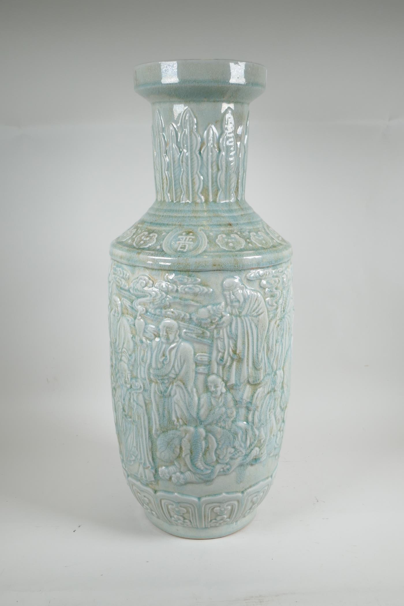 A Chinese celadon glazed ceramic vase, with raised decoration, 24" high