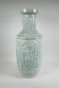 A Chinese celadon glazed ceramic vase, with raised decoration, 24" high