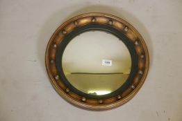 A Regency style convex mirror, early C20th, 16" diameter