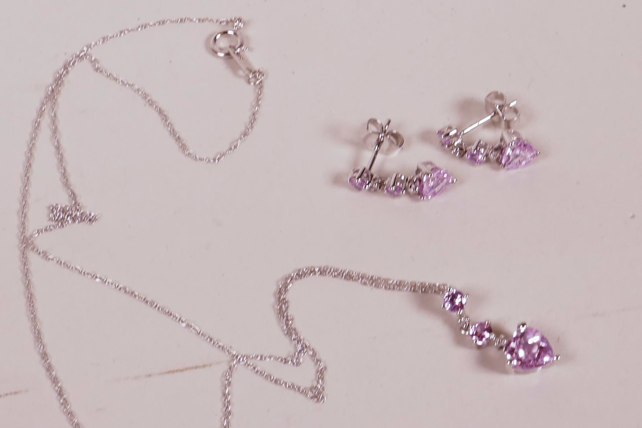 A 10ct white gold necklace with pink sapphire heart shaped pendant and matching drop earrings - Image 3 of 3