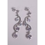 A pair of silver and cubic zirconium drop earrings, 1½" drop