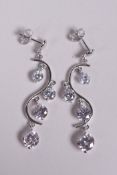 A pair of silver and cubic zirconium drop earrings, 1½" drop