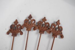 Four decorative Gothic style iron plant stakes, 42"