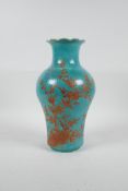 A Chinese turquoise blue ground porcelain vase with iron red and gilt decoration of birds perched on