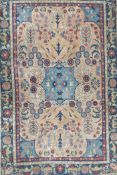 A pair of early C20th Persian multicolour ground rugs with a floral medallion design and green