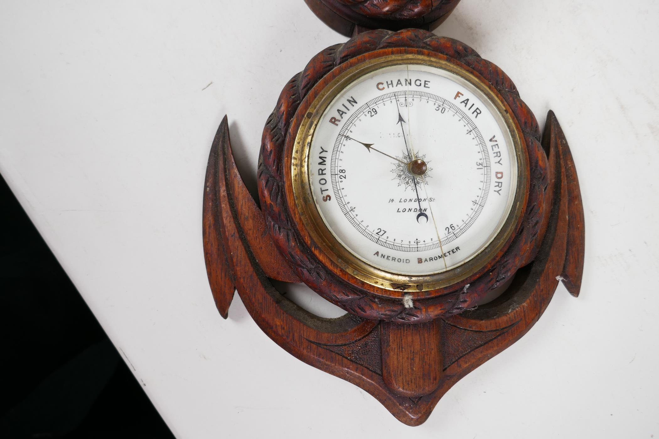 A nautical themed aneroid barometer and clock mounted in a carved oak rope and anchor frame, 21" - Image 3 of 3