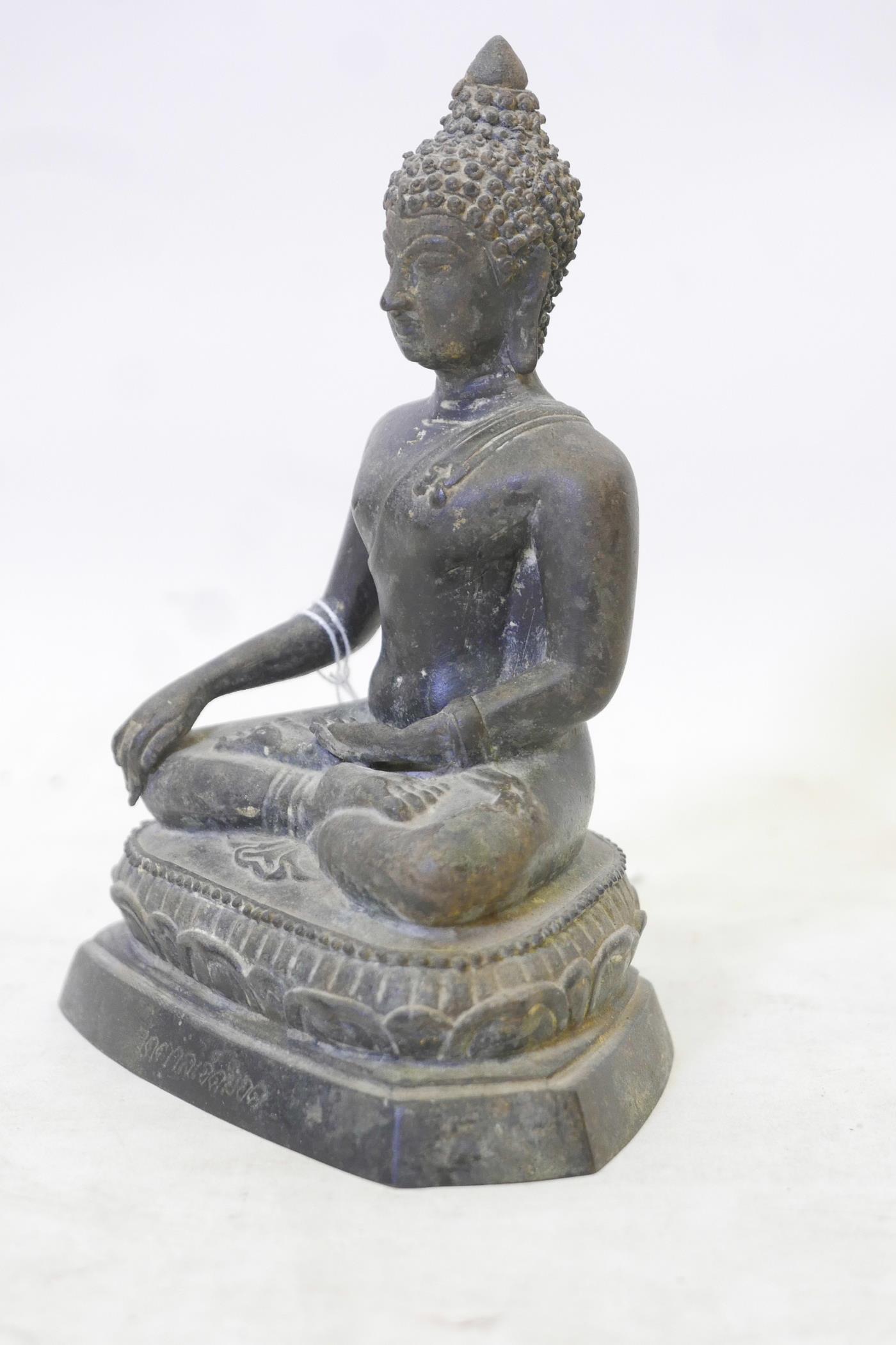 A C19th Siamese bronze Buddha, seated upon a lotus throne and inscribed to the base, 8" high - Image 2 of 5