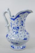 A classical style blue and white pottery ewer decorated with flowers, 12" high