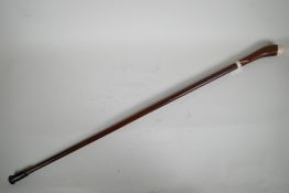 A vintage hardwood walking stick with bone mounts, 35" long
