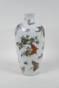 A Chinese polychrome porcelain vase with enamelled butterfly decoration, seal mark to base, 10" high
