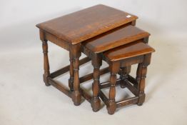 A 'Priory' oak nest of three tables in the old charm style, 24" x 15", 19" high