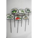 A set of six painted cast metal vegetable markers, 4¼" x 4", courgette, beans, carrot, potato,