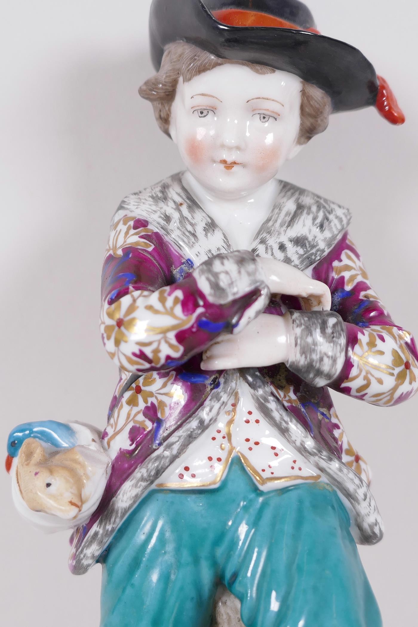 A Continental porcelain figure of a boy skater with a swag of game on his belt, anchor mark to base, - Image 4 of 5