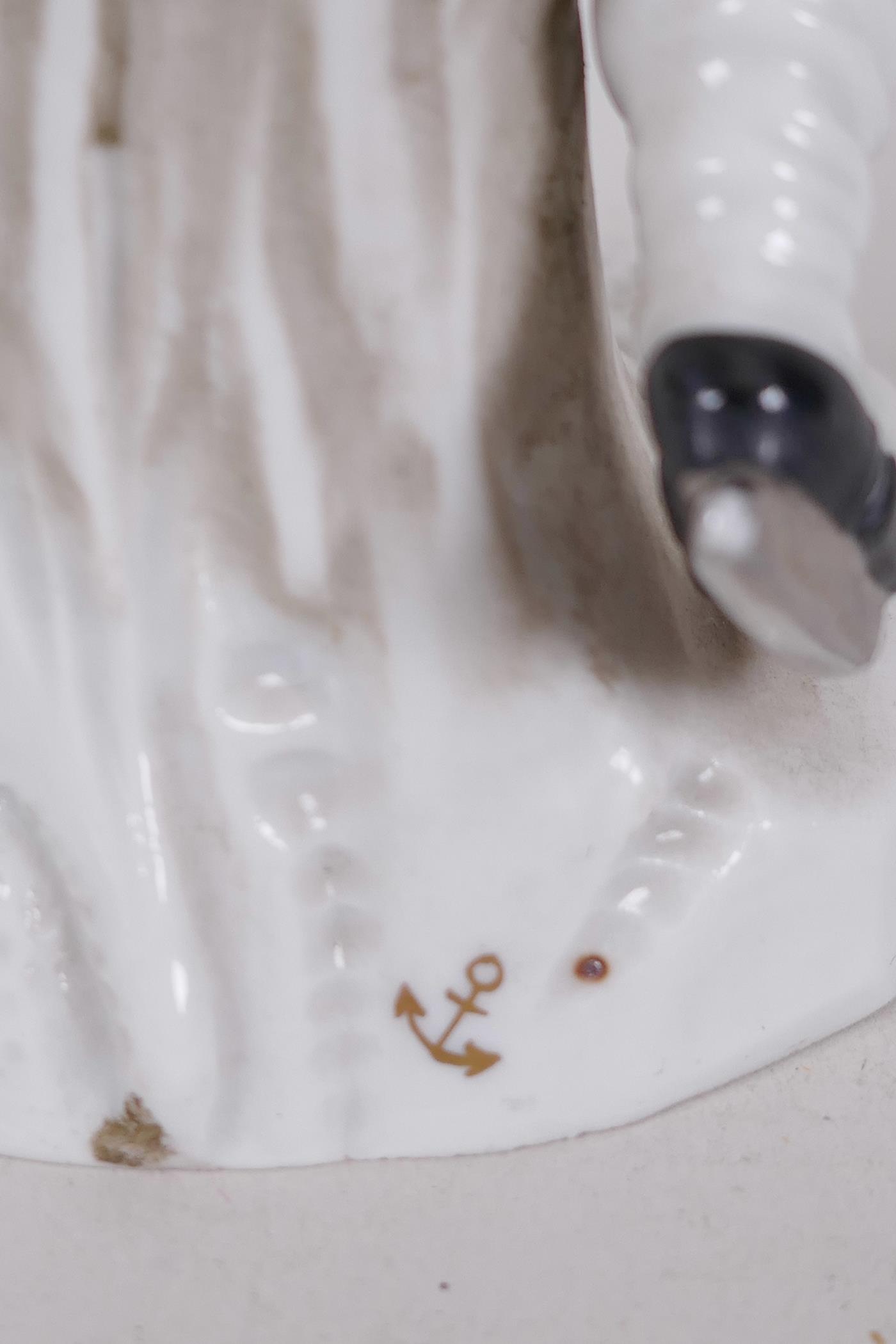 A Continental porcelain figure of a boy skater with a swag of game on his belt, anchor mark to base, - Image 5 of 5