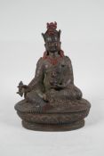 A Sino-Tibetan patinated bronze deity carrying a vajra and stupa, 7½" high