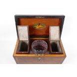 An early Regency (c.1820) Cuban mahogany two compartment tea caddy, the case crossbanded with