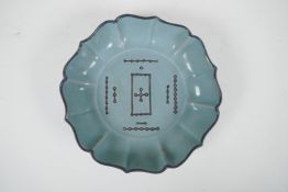 A Chinese Ru ware style celadon glazed dish of lobed form, with chased decoration to the bowl, 7½"
