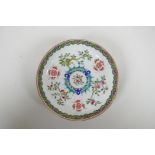 An early C20th Chinese famille verte porcelain dish decorated with bats, auspicious symbols and