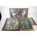 A collection of framed displays of replica golfing trophies, largest 27½" x 13", and a colour