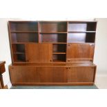 A mid century Danish rosewood side cabinet in two sections, probably Mobler, Danish furniture