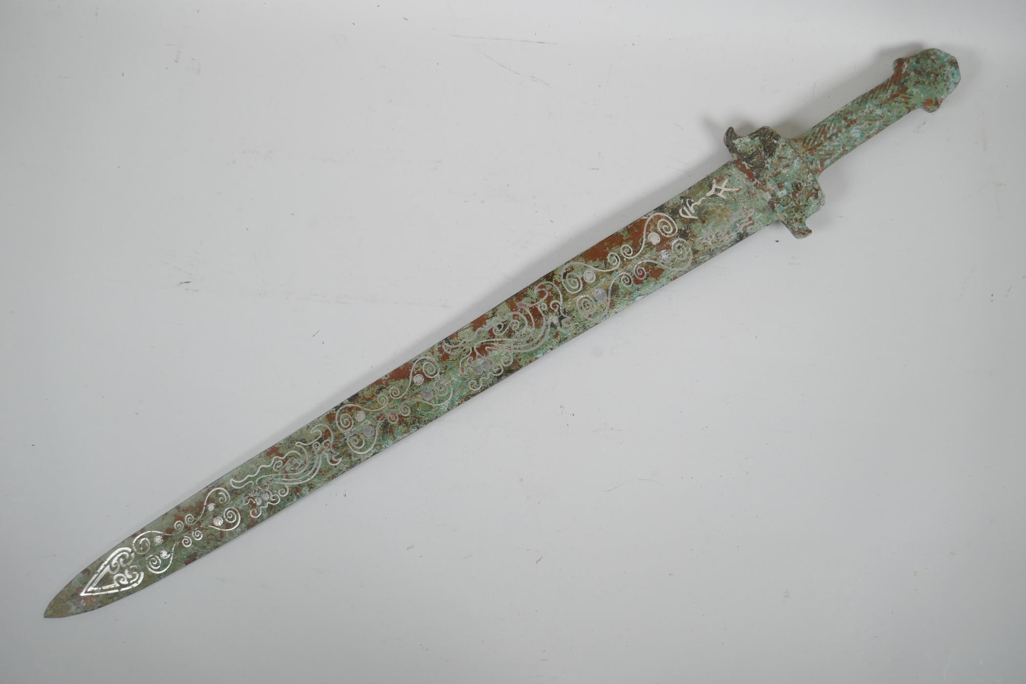 A Chinese archaic style mixed metal short sword, the blade with stylised line decoration, 26" long