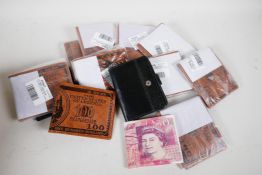 A collection of wallets including novelty UK £50 note and US $100 bills