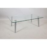 A contemporary glass and brushed steel coffee table, 39½" x 24" x 13"