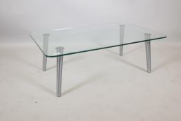 A contemporary glass and brushed steel coffee table, 39½" x 24" x 13"