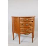 A Louis XV style demi-lune three drawer commode, with inset burr walnut inlaid panels, brass handles