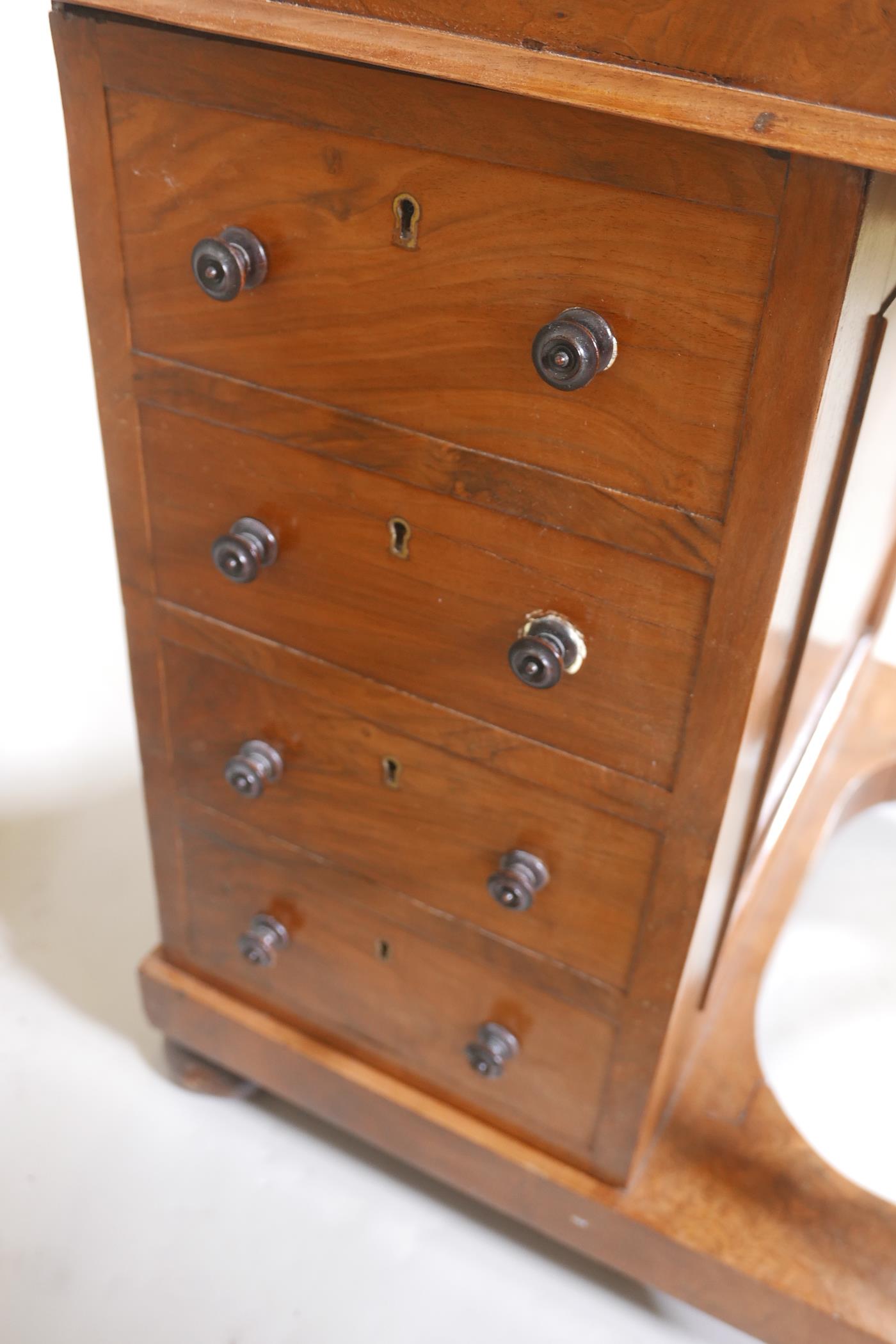 A Victorian figured walnut davenport with carved piano legs, tooled leather inset top and fitted - Image 7 of 9