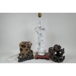 A Chinese table lamp, the base mounted with a figure of Quan Yin, 16" high, together with two carved