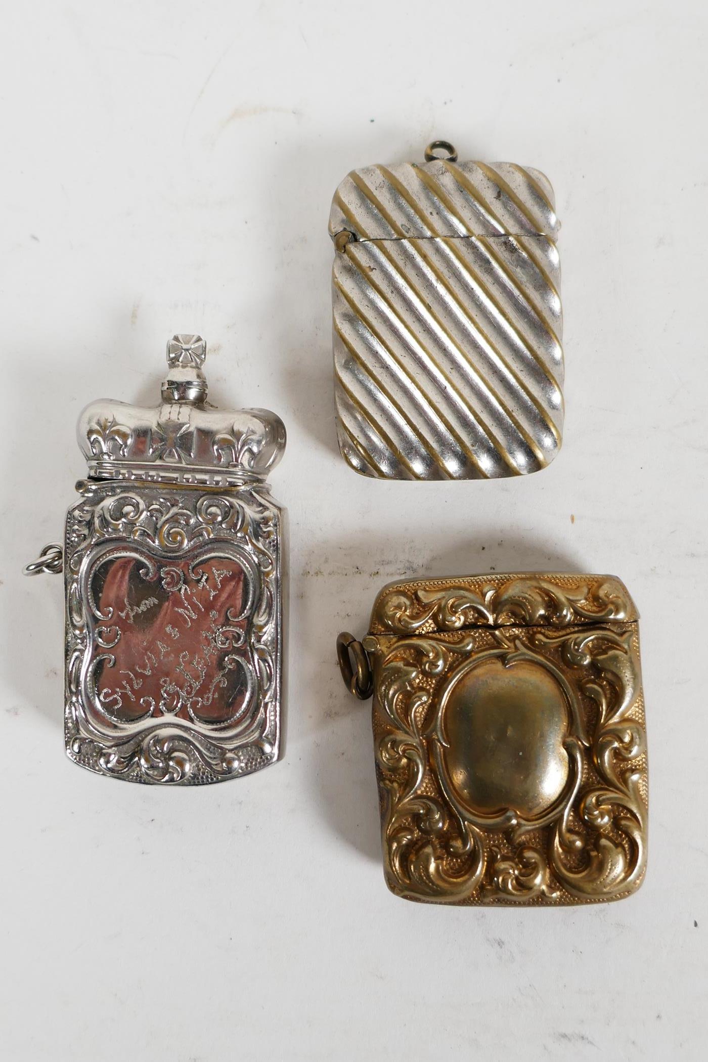 Three decorative Victorian and early C20th match safe vesta cases; one silver plated and topped with