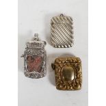 Three decorative Victorian and early C20th match safe vesta cases; one silver plated and topped with