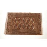 A brown ground Bokhara rug, 33½" x 53"